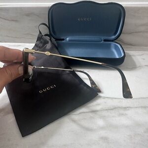Gucci Women's Sunglasses with Gold Frame and Brown Temples